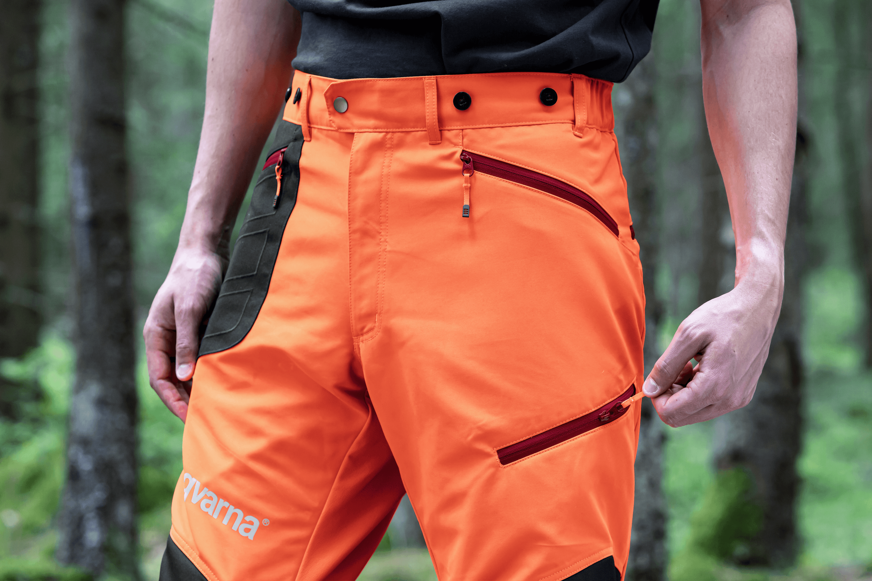 man wearing ppe with chainsaw